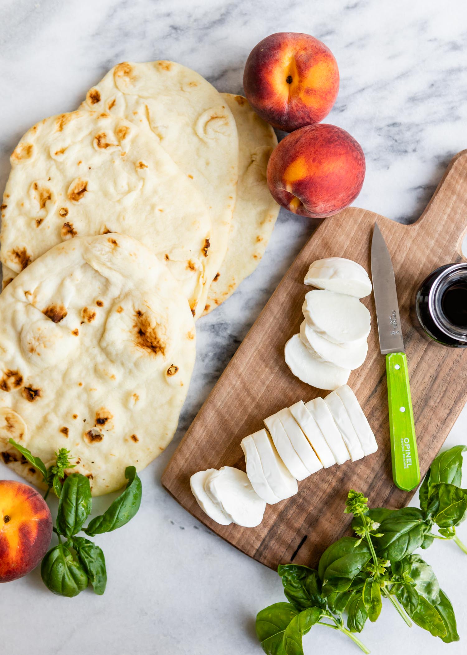 This Grilled Peach Caprese Naan Pizza Is the Ultimate Easy Summer Meal