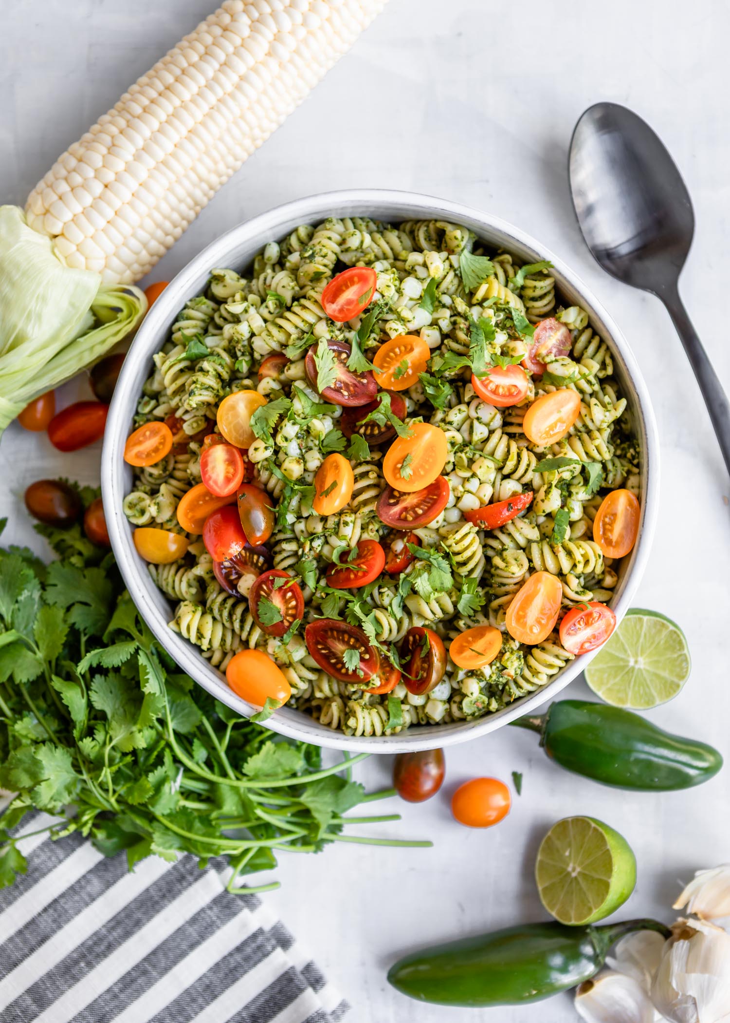 Jalepeno Cilantro Pesto Rotini with Corn and Grape Tomatoes | HelloVeggie.co