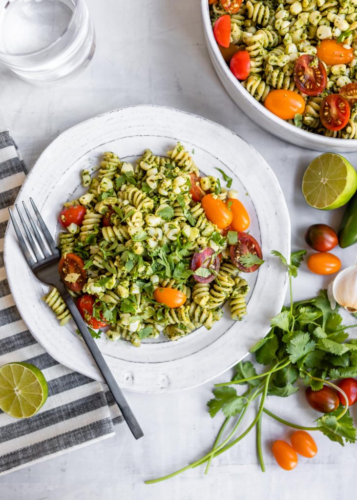 Jalepeno Cilantro Pesto Rotini with Corn and Grape Tomatoes | HelloVeggie.co